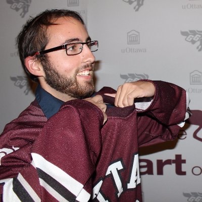 Liam wearing a Gee-Gees hockey jersey