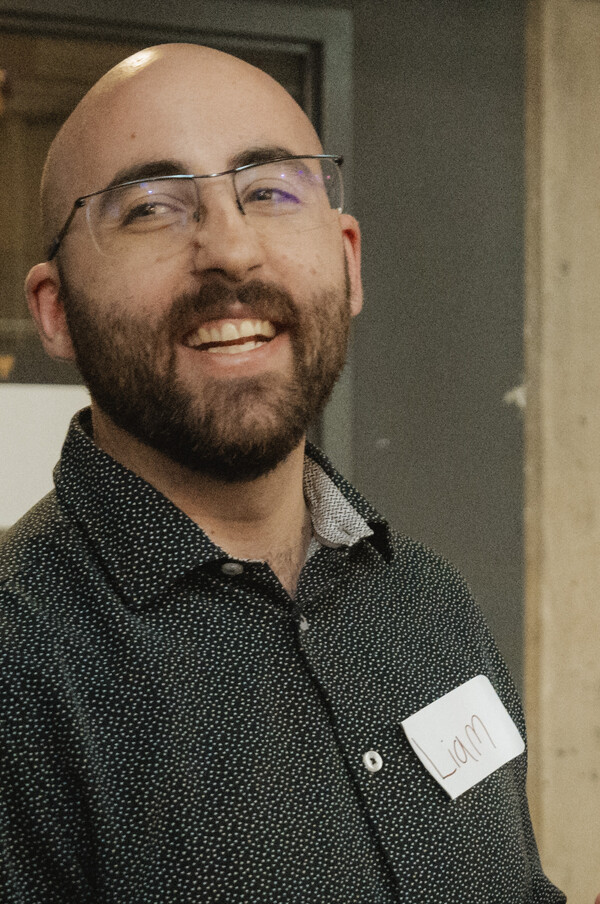 Liam smiling at the Women in Tech Summit